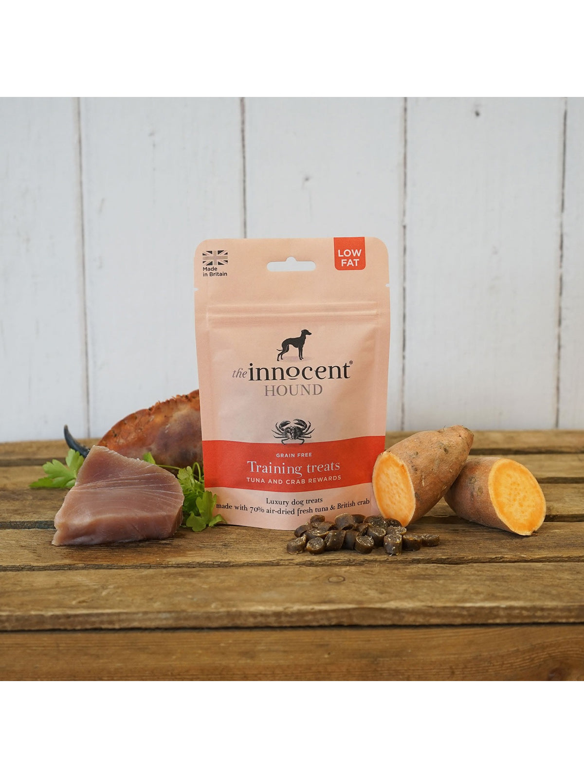The Innocent Hound Training Treats Tuna & Crab Rewards in a 70g pouch, shown with tuna and sweet potato