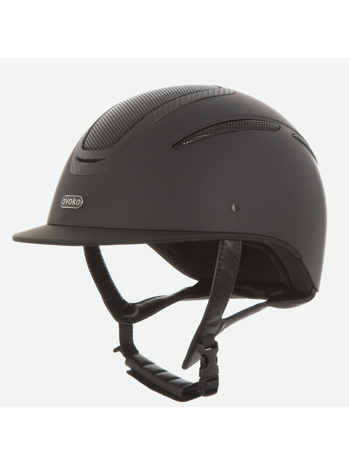 A matte black equestrian riding helmet with a visor, featuring a subtle carbon fiber pattern on the top ventilation panels and a white 'soko' brand logo on the side, set against a plain light gray background.