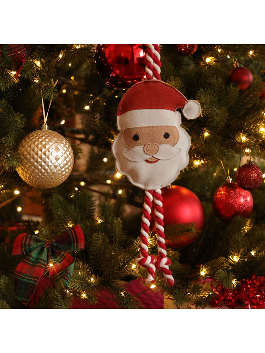 Benji & Flo Christmas Dog Toy Ho Ho Ho Santa, a suede Santa face toy with a red and white braided rope, hanging on a Christmas tree